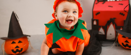 Baby dressed as a pumpkin for halloween