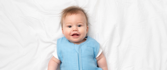 baby in blue baby sleeping bag