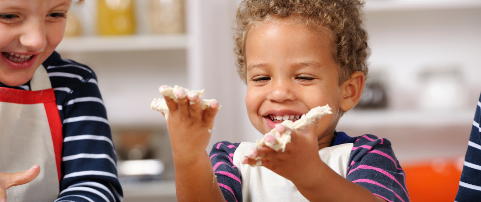 two boys baking and laughing