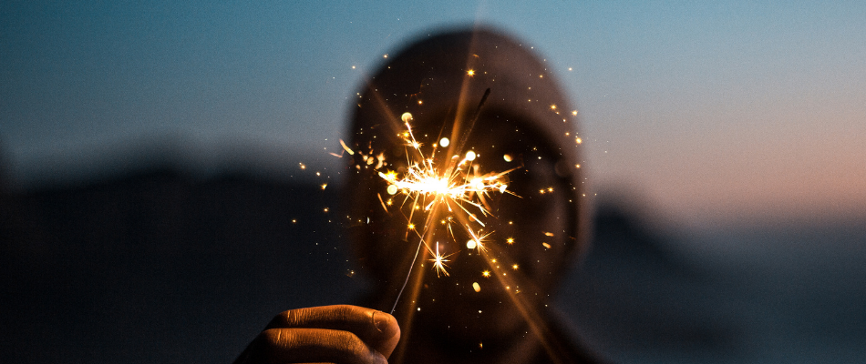 child with sparkler for firework night