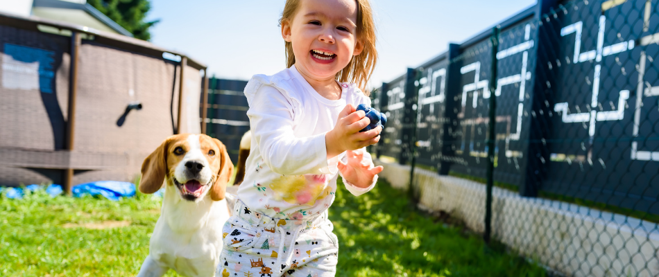 girl with her pet dog in the garden
