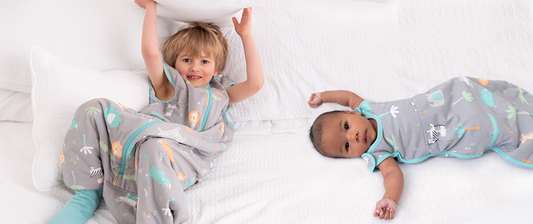 toddler and baby in baby sleeping bag and sleeping bag with feet