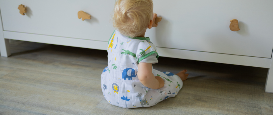 baby in summer sleeping bag with feet in jungle print