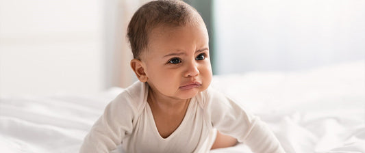 baby crawling and looking frustrated